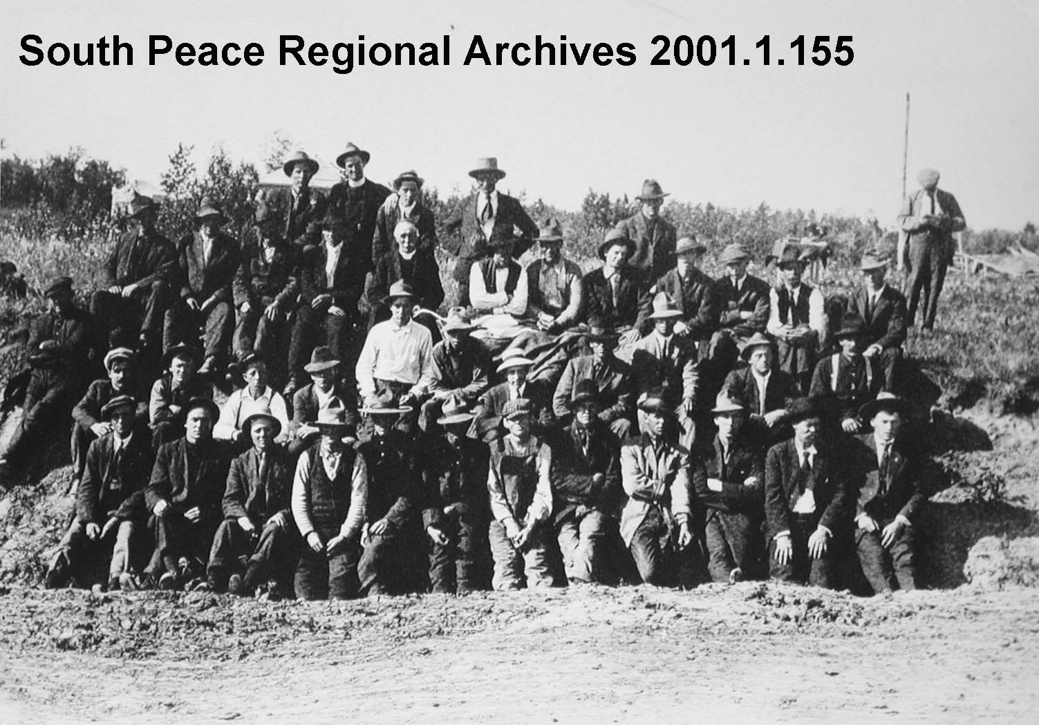 Group photo of approximately 45 men enlisting for WWI from the Lake Saskatoon area. ~1914 