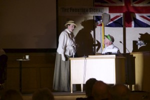 A suffragette scolding the newspaper editor during the play.