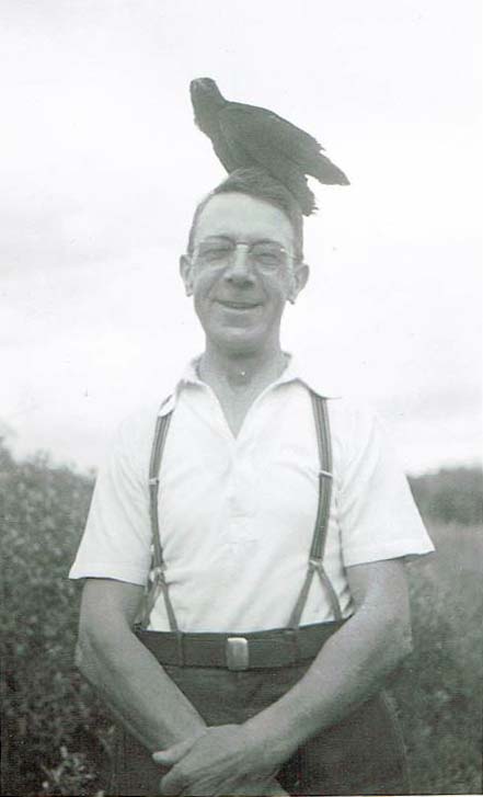 Walter Medlock, local barber, with his tame crow.  Courtesy of Kathryn Auger, Walter's granddaughter