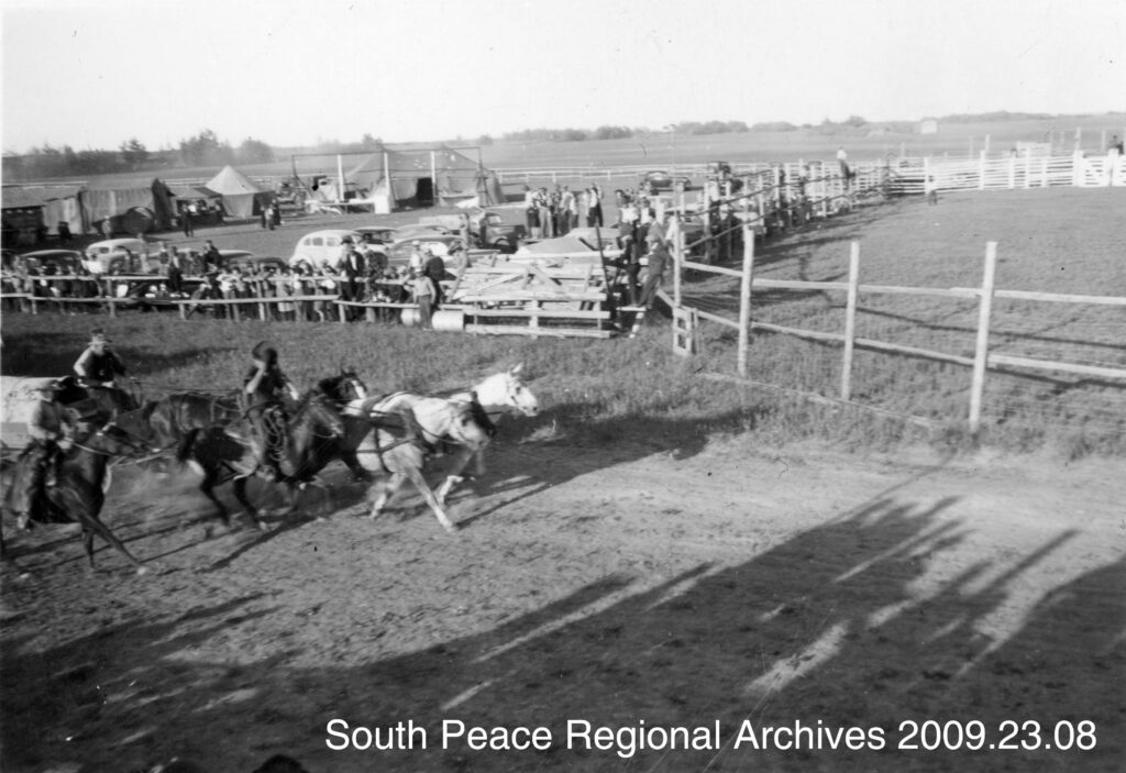 The Teepee Creek Stampede showing chuck wagon races, ca. 1948