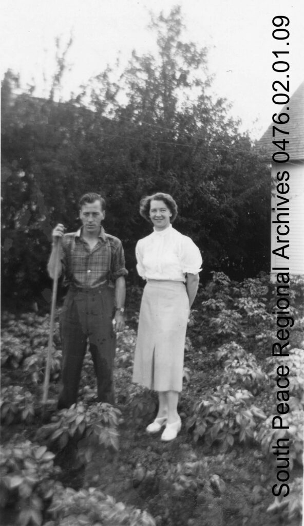 Jimmy and Peggy Mair of Grande Prairie in the potato garden, 1954